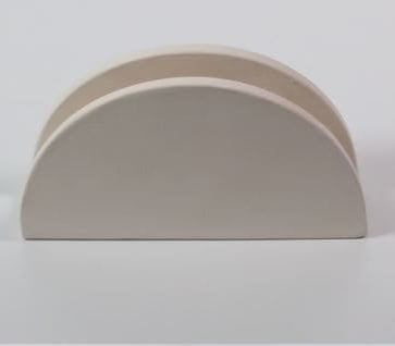 Detalle de la forma lunar y acabado del servilletero de cerámica personalizable.